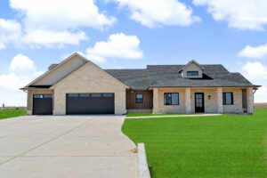Front exterior view with dual garage and driveway