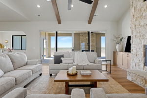 Living area with sliding doors to back patio with gas fireplace inside and outside