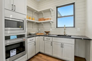 Butler's pantry with built-in oven and microwave
