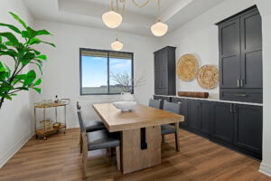 Dining area with built-in cabinets and window