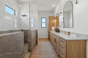 Master bath with walk-in shower and dual vanity