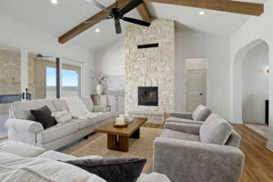 Living area with gas fireplace and exposed wooden beams