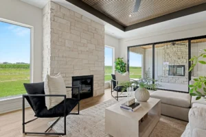 Gas fireplace in living area with sliding glass doors facing the outdoor patio