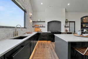 Sink with panoramic view of the backyard