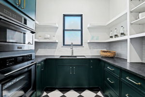 Butler's pantry with sink and built-in cabinetry