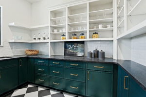 Butler's pantry with built-in cabinetry and shelving