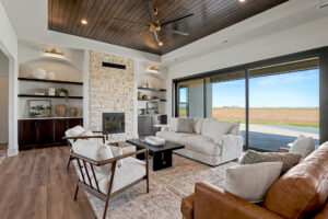 Living area with built-in shelving surrounding gas fireplace
