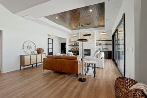 Living area with wood panel ceiling and gas fireplace