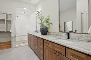 Master bathroom with dual vanity and walk-in shower
